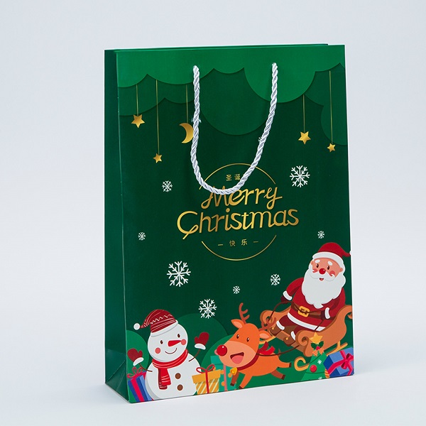 A beautiful paper Christmas bag rises in the wind